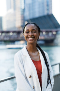 A photo of Jessica Daniels in front of the Chicago River